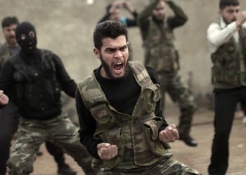 FILE - In this Dec. 17, 2012, file photo, Syrian rebels attend a training session in Maaret Ikhwan near Idlib, Syria. Fewer than 100 Syrian rebels are currently being trained by the U.S. military to fight the Islamic State group, a tiny total for a sputtering program with a stated goal of producing 5,400 fighters a year. The training effort is moving so slowly that critics question whether it can produce enough capable fighters quickly enough to make a difference. Military officials said this past week that they still hope for 3,000 by year’s end. Privately, they acknowledge the trend is moving in the wrong direction.  (AP Photo/Muhammed Muheisen, File)