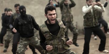 FILE - In this Dec. 17, 2012, file photo, Syrian rebels attend a training session in Maaret Ikhwan near Idlib, Syria. Fewer than 100 Syrian rebels are currently being trained by the U.S. military to fight the Islamic State group, a tiny total for a sputtering program with a stated goal of producing 5,400 fighters a year. The training effort is moving so slowly that critics question whether it can produce enough capable fighters quickly enough to make a difference. Military officials said this past week that they still hope for 3,000 by year’s end. Privately, they acknowledge the trend is moving in the wrong direction.  (AP Photo/Muhammed Muheisen, File)