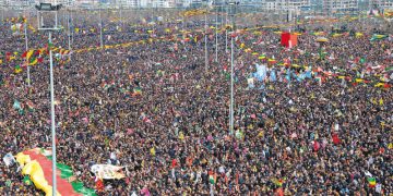 Kurds wave flags as they as they gather to celebrate Newroz, the Kurdish New Year, in the southeastern Turkish city of Diyarbakir, on March 21, 2015. Newroz, which means "new day" in Kurdish and marks the first day of Spring, is also celebrated in Iran, Afghanistan, Azerbaijan, Albania, Bahrain, Georgia, Turkmenistan, Tajikistan, Uzbekistan, Kyrgyzstan and Kazakhstan, as well as among various other Iranian and Turkic peoples in Iraqi Kurdistan, Syria, Lebanon, Pakistan, India, northwestern China, the Caucasus, the Crimea, and the Balkans. AFP PHOTO / ILYAS AKENGIN